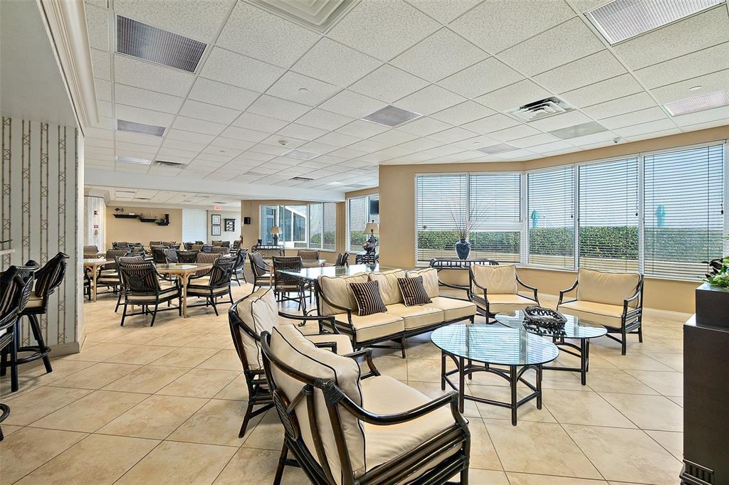 2937 South Atlantic Avenue, Unit 1907 Daytona Beach Shores, FL 32118 - Photo 48 of 55 a living room with furniture and a large window