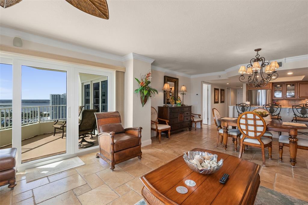 2937 South Atlantic Avenue, Unit 1907 Daytona Beach Shores, FL 32118 - Photo 6 of 55 a living room with furniture and a floor to ceiling window