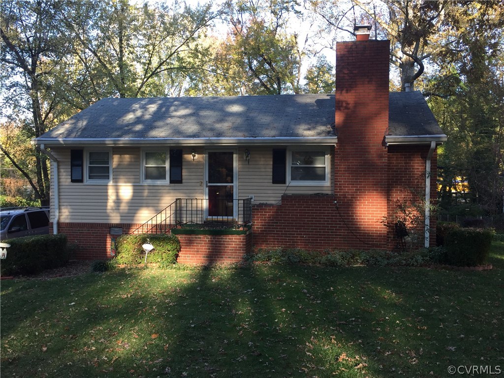2109 Marroit Road Henrico, VA 23229 - Photo 2 of 2 a front view of a house with yard and green space