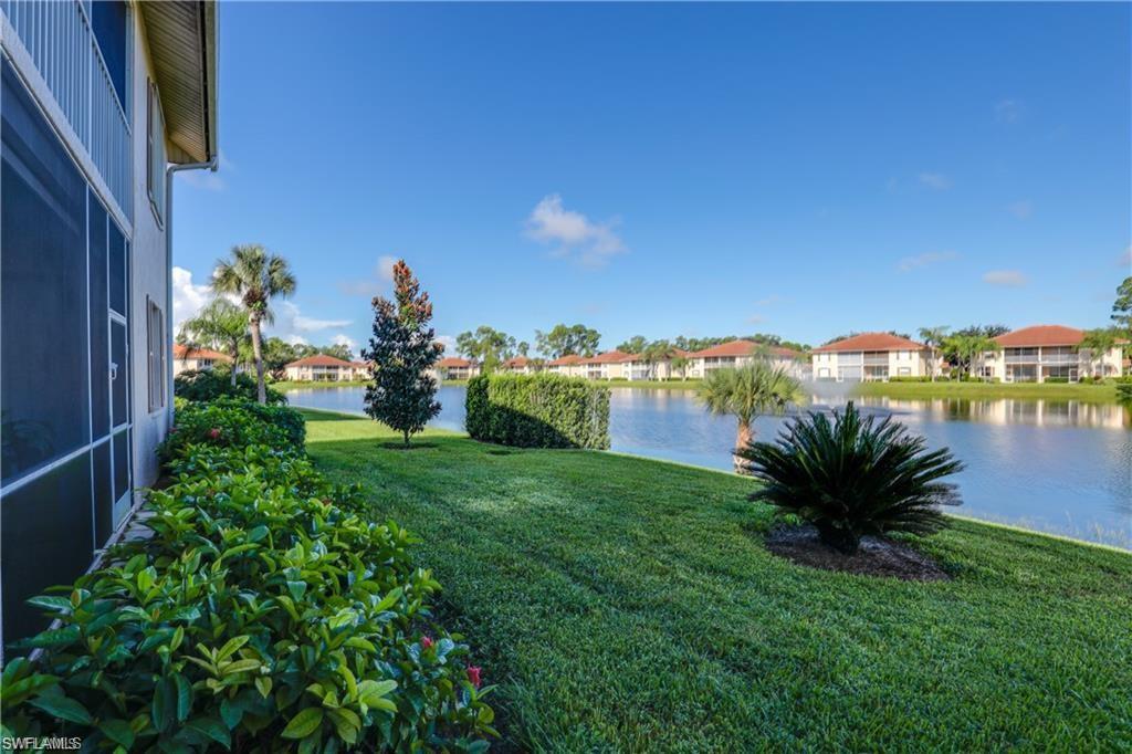 300 Robin Hood Circle, Unit 102 Naples, FL 34104 - Photo 1 of 24 a view of a garden with a building in back