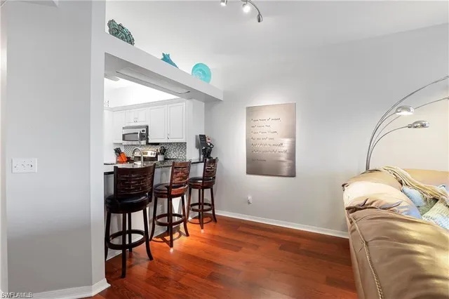 a view of a dining room with furniture and wooden floor