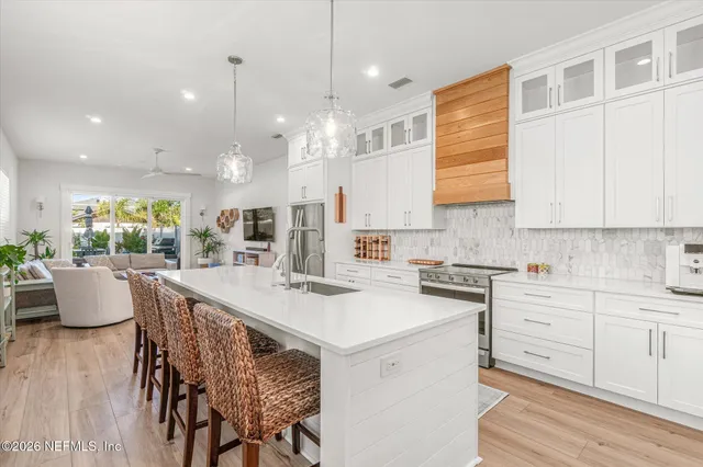 a dining room with furniture and wooden floor