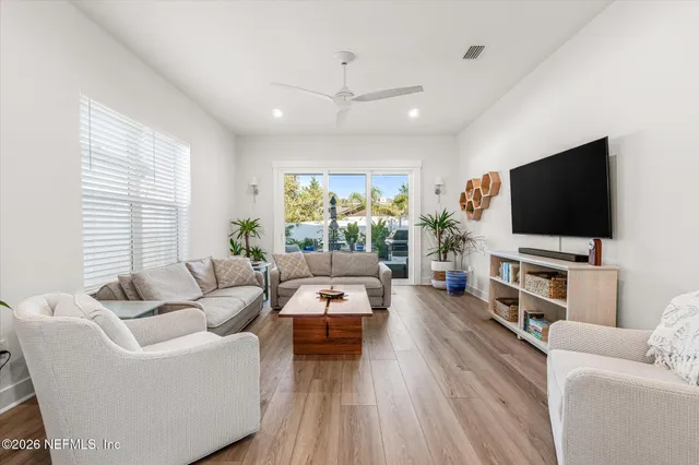 a view of entryway and hall with wooden floor
