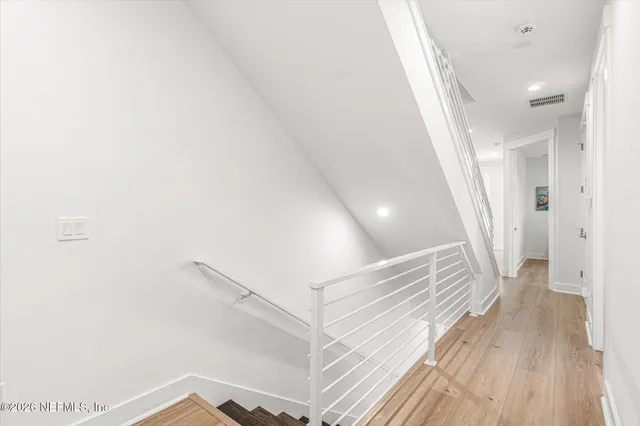 a bathroom with a shower sink and mirror