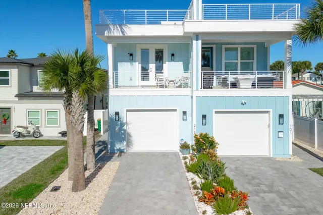 a view of a patio with table and chairs