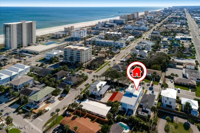 a view of a balcony with two chairs and a table