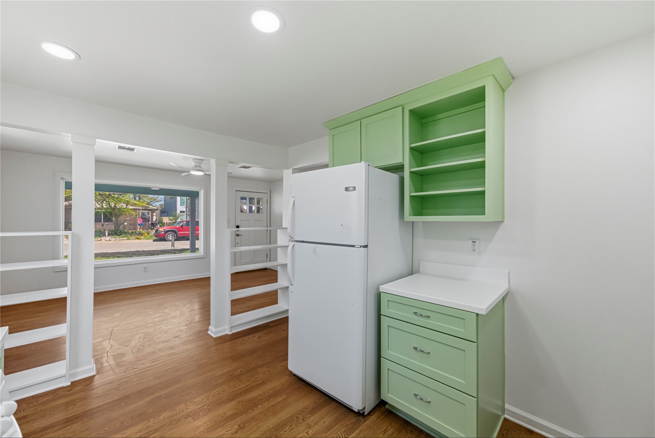503 West Croslin Street Austin, TX 78752 - Photo 11 of 24 a white refrigerator freezer and a stove sitting inside of a kitchen
