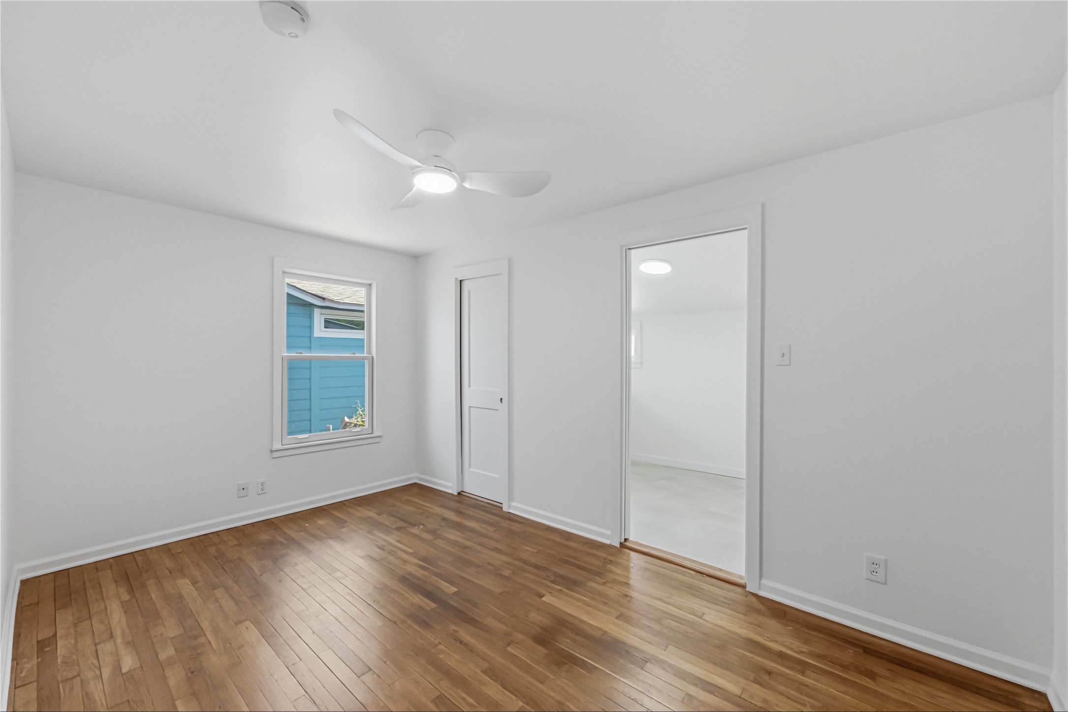 503 West Croslin Street Austin, TX 78752 - Photo 17 of 24 an empty room with wooden floor and windows