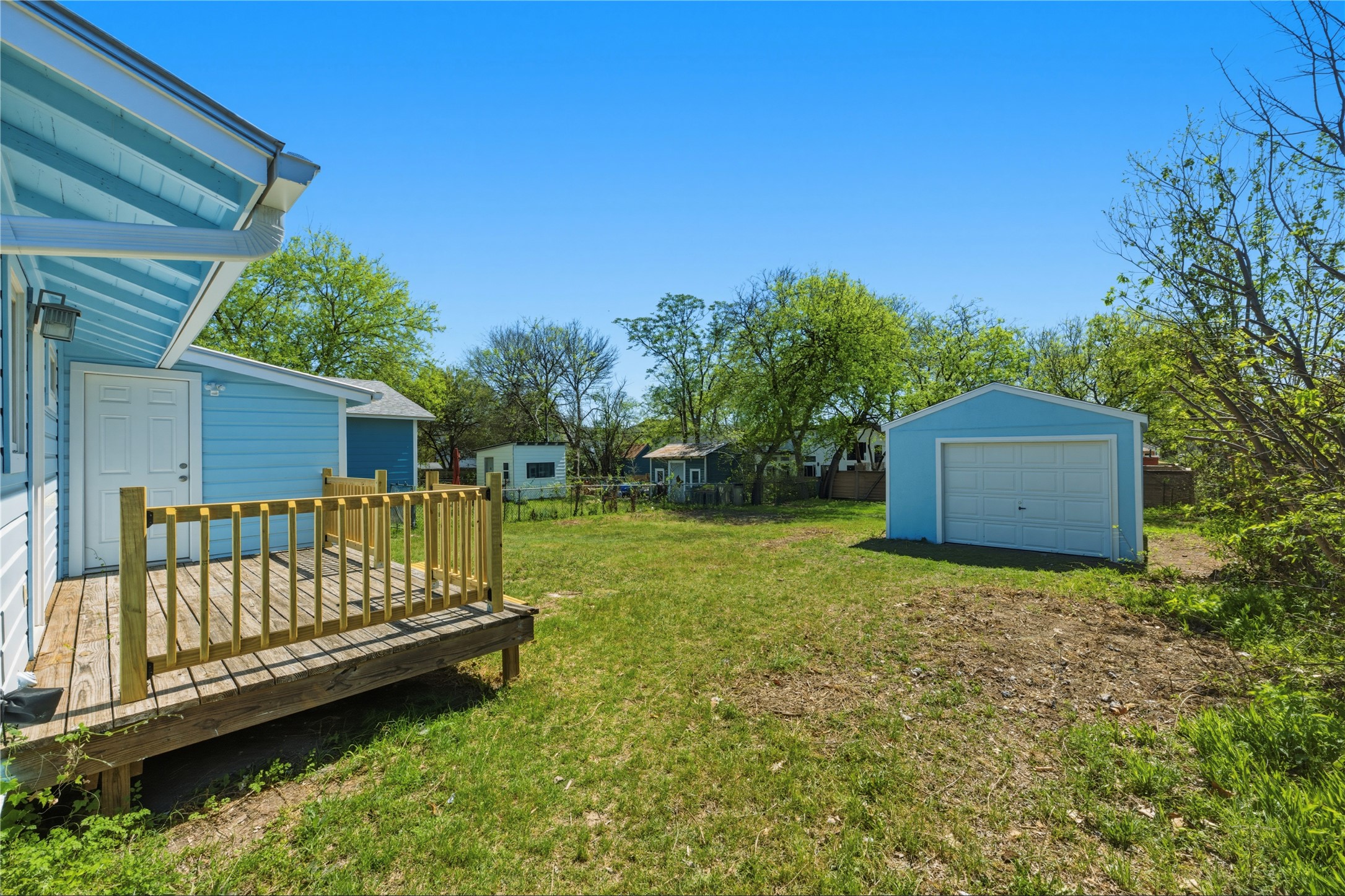 503 West Croslin Street Austin, TX 78752 - Photo 20 of 24 a view of a wooden deck with a yard