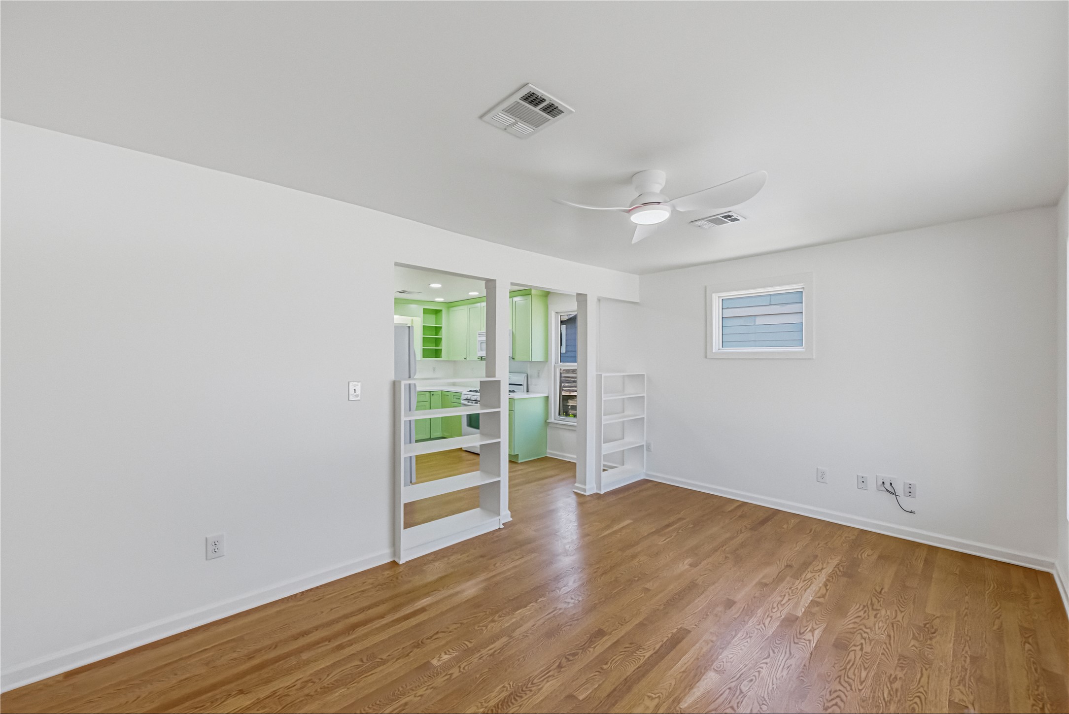 503 West Croslin Street Austin, TX 78752 - Photo 6 of 24 wooden floor in an empty room with a window