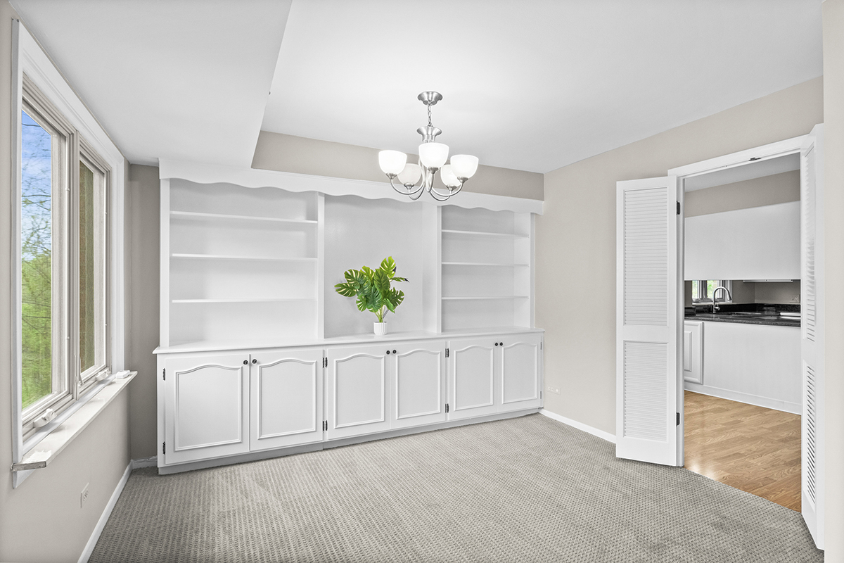 2420 West Talcott Road, Unit 211 Park Ridge, IL 60068 - Photo 8 of 28 a view of an empty room with a window