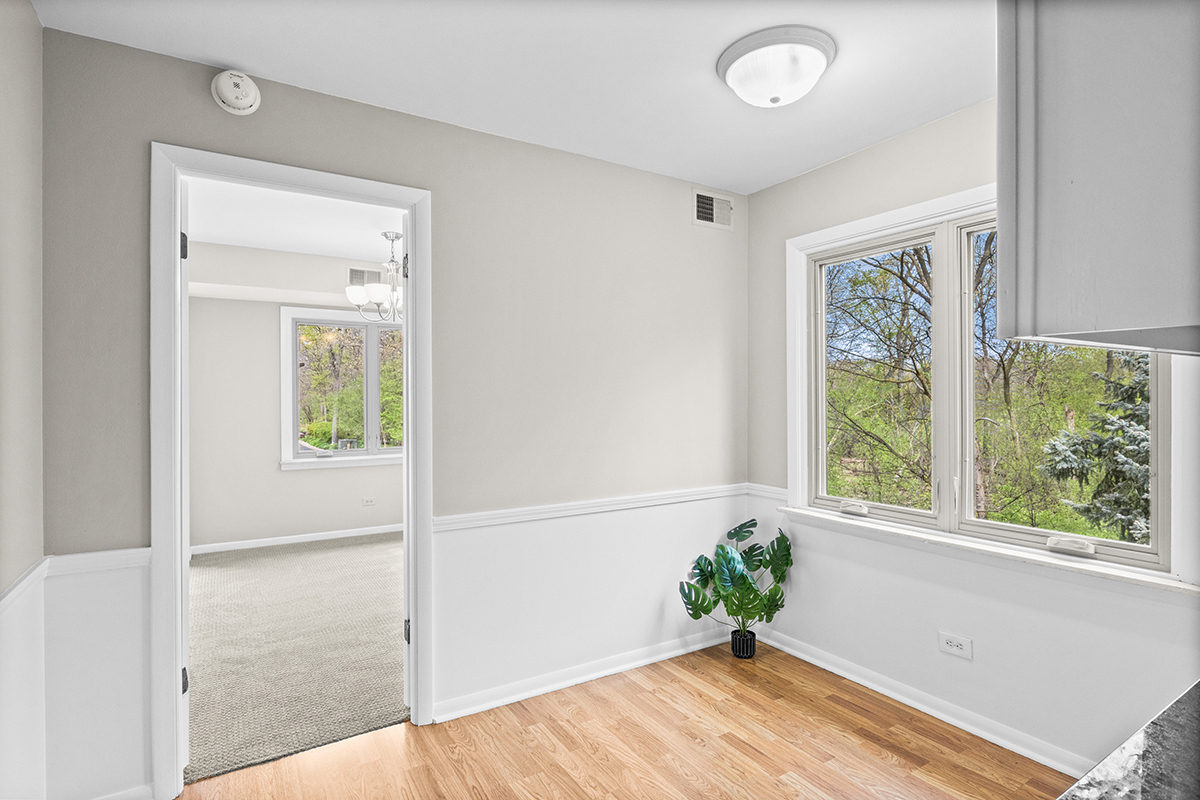 2420 West Talcott Road, Unit 211 Park Ridge, IL 60068 - Photo 10 of 28 a view of an entryway with wooden floor and a window