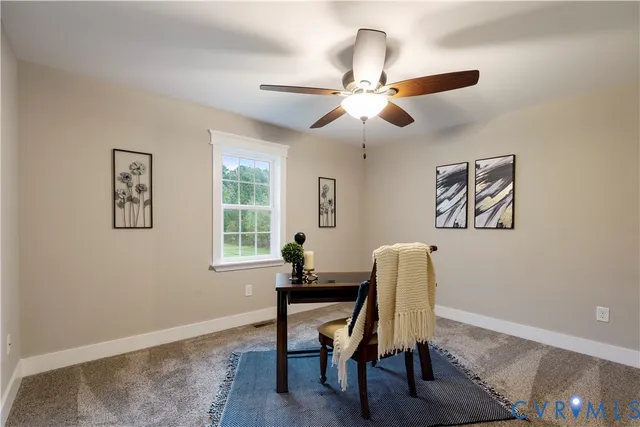 a workspace with furniture and a window