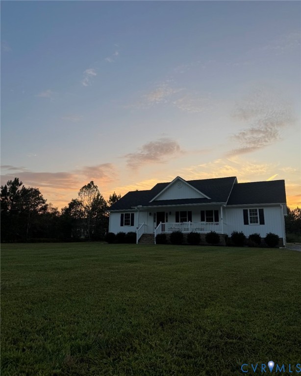 12442 Quaker Road Dinwiddie, VA 23841 - Photo 27 of 28 Ranch-style house featuring a porch and a yard