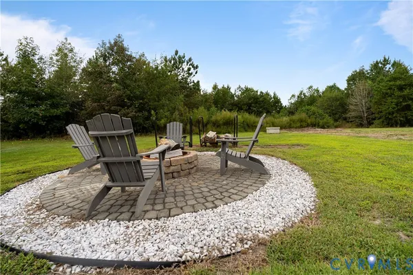 a view of a backyard with sitting area