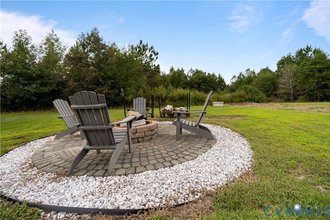 12442 Quaker Road Dinwiddie, VA 23841 - Photo 8 of 28 View of patio featuring an outdoor fire pit