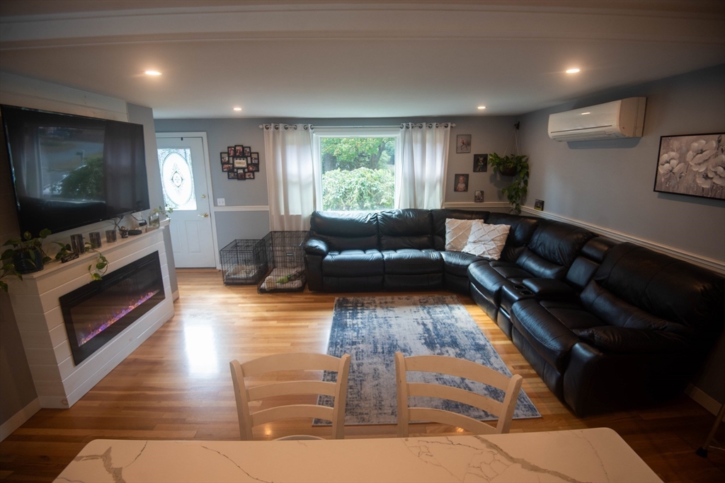 18 Birchwood Road Rutland, MA 01543 - Photo 12 of 42 a living room with furniture and a flat screen tv