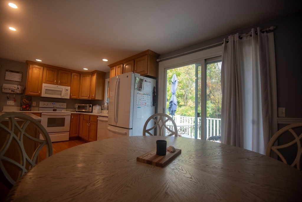 18 Birchwood Road Rutland, MA 01543 - Photo 22 of 42 a view of a kitchen with refrigerator and windows