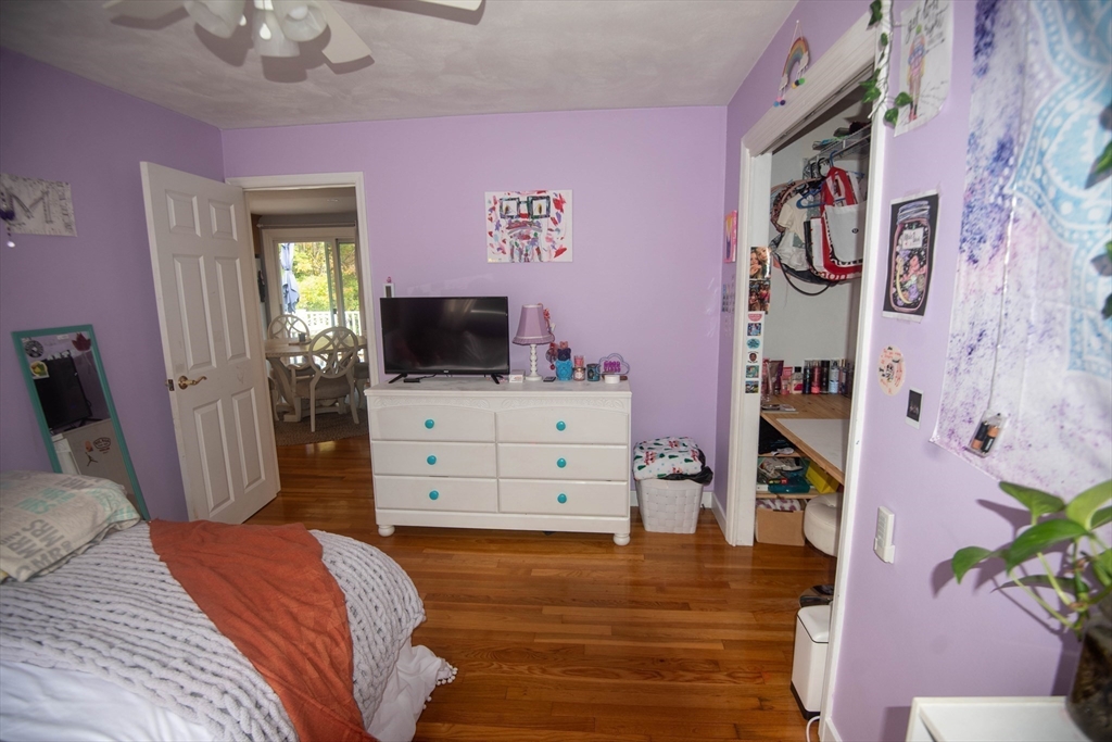 18 Birchwood Road Rutland, MA 01543 - Photo 26 of 42 a bedroom with a bed and flat screen tv
