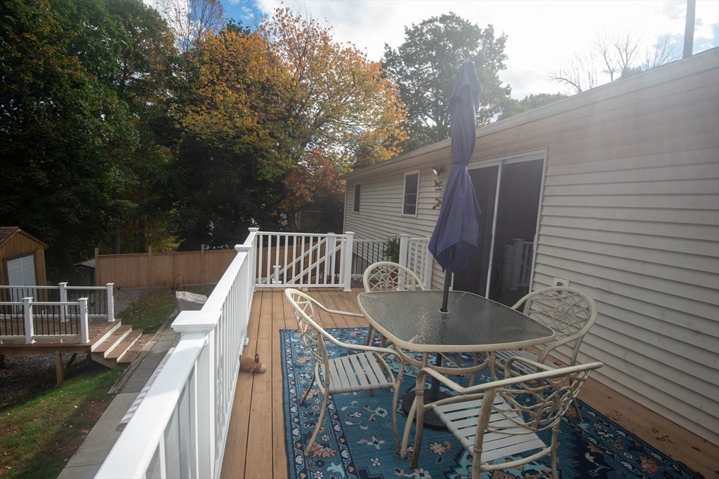 18 Birchwood Road Rutland, MA 01543 - Photo 9 of 42 a view of backyard with roof deck and seating space