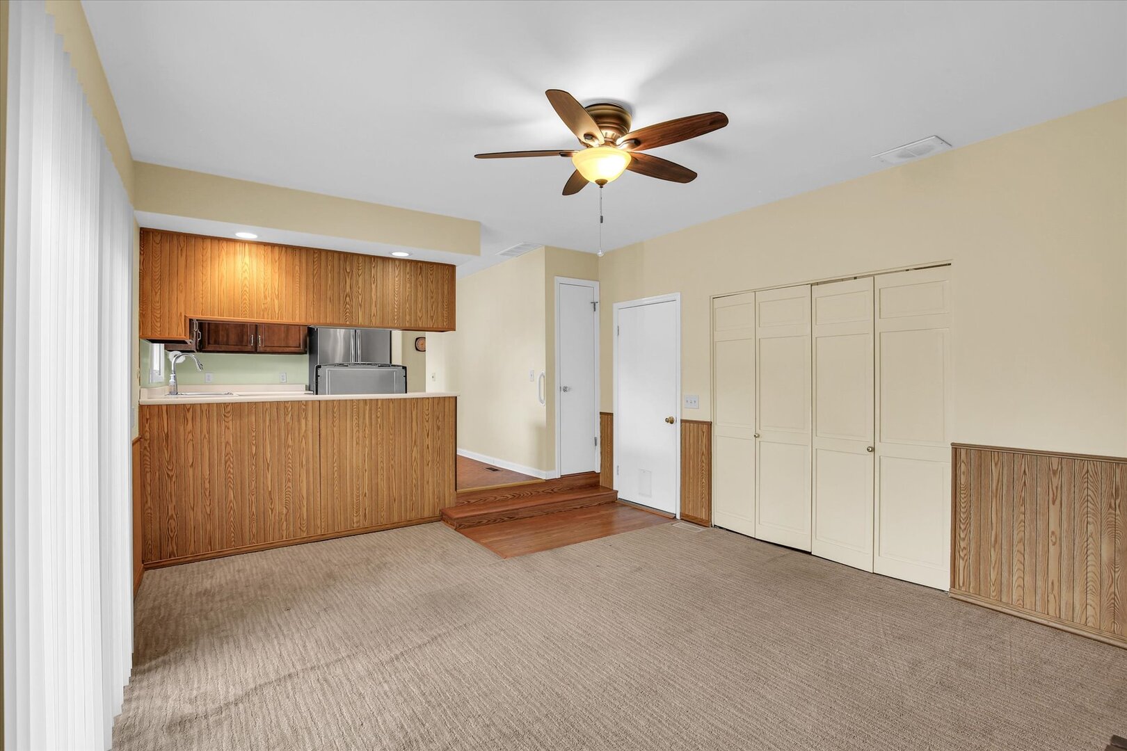 2302 Blackthorn Drive Champaign, IL 61821 - Photo 16 of 31 a view of a livingroom with a ceiling fan and entryway