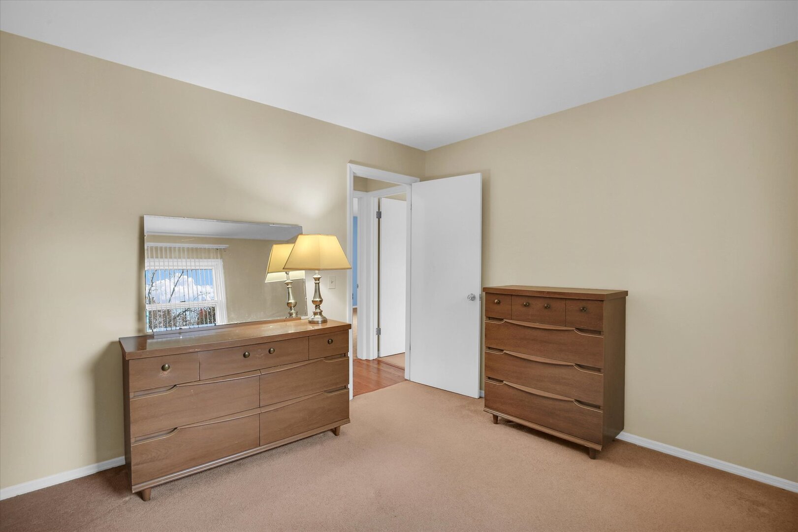 2302 Blackthorn Drive Champaign, IL 61821 - Photo 18 of 31 a room with a lamp and dresser