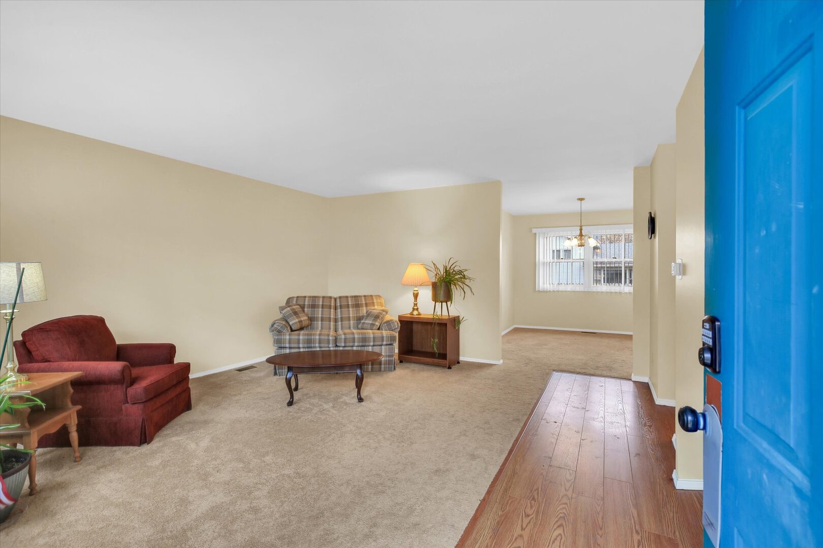 2302 Blackthorn Drive Champaign, IL 61821 - Photo 2 of 31 a living room with furniture and a wooden floor