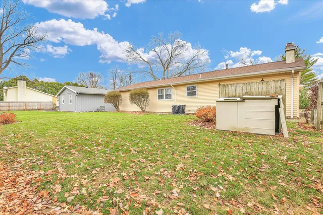 a view of a house with a yard