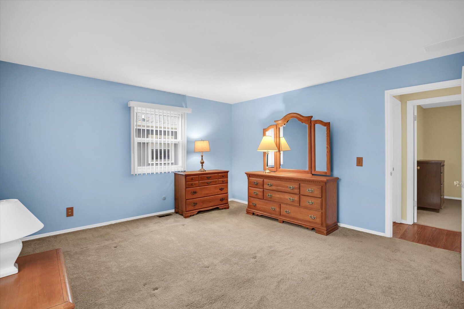 2302 Blackthorn Drive Champaign, IL 61821 - Photo 5 of 31 an empty room with windows and cabinet