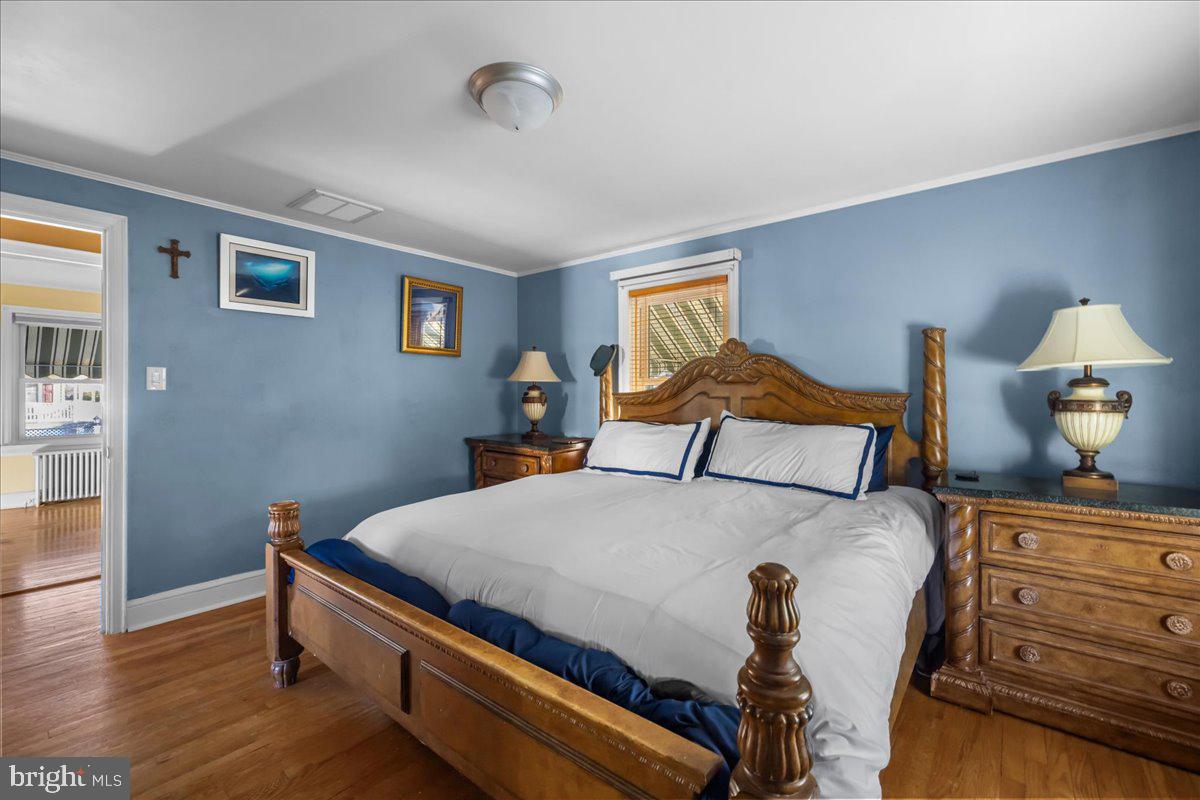 227 Miller Street Winchester, VA 22601 - Photo 21 of 51 a bedroom with a bed and wooden floor