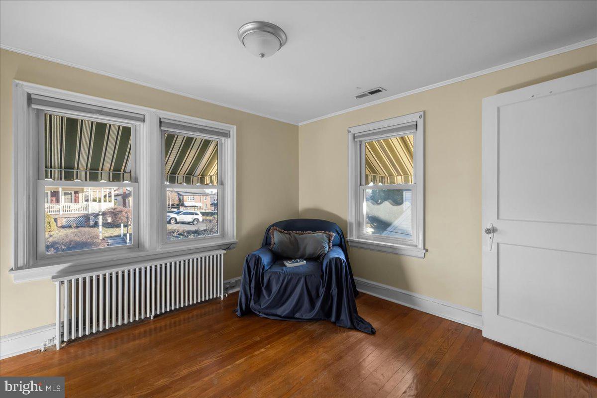 227 Miller Street Winchester, VA 22601 - Photo 26 of 51 a bedroom with a window and a chair