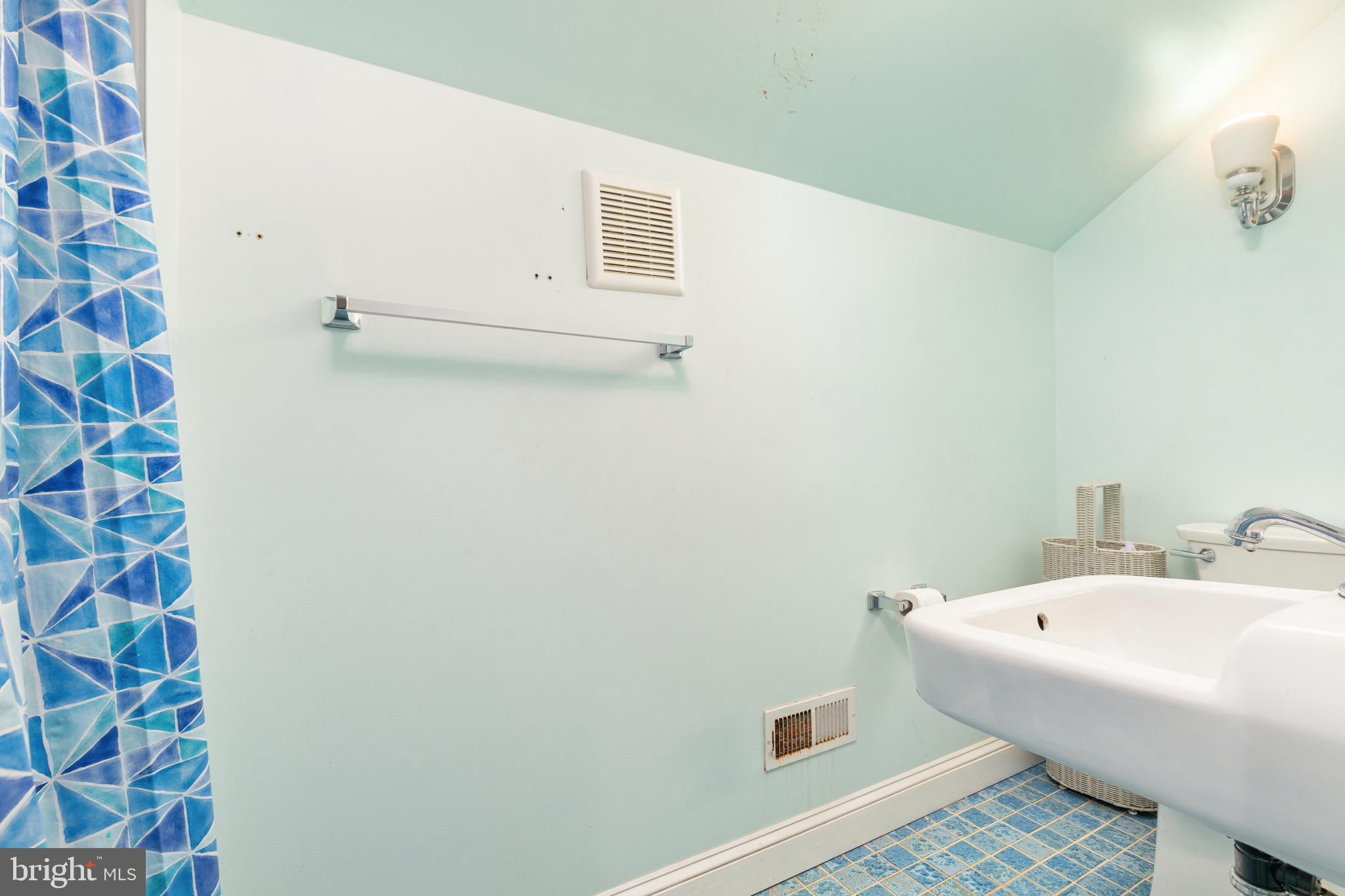 227 Miller Street Winchester, VA 22601 - Photo 31 of 51 a bathroom with a sink and mirror