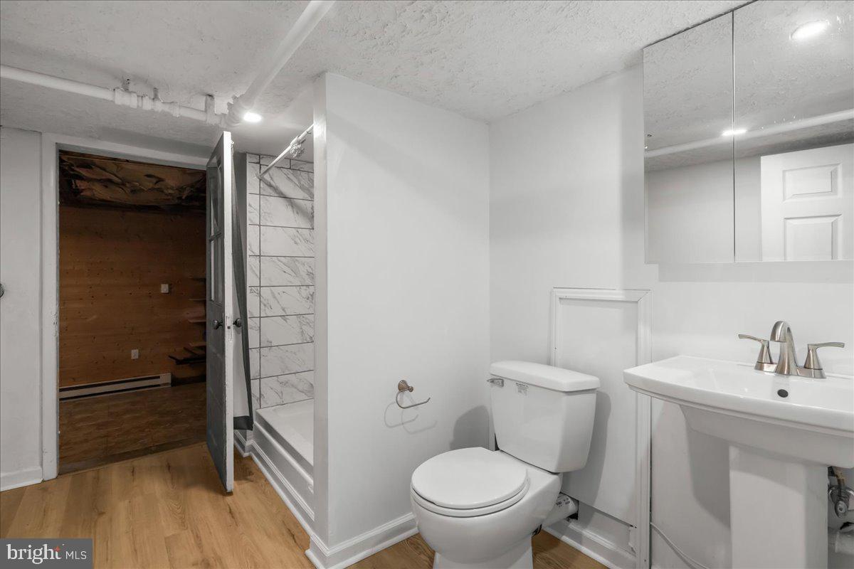227 Miller Street Winchester, VA 22601 - Photo 33 of 51 a bathroom with a toilet a sink and shower