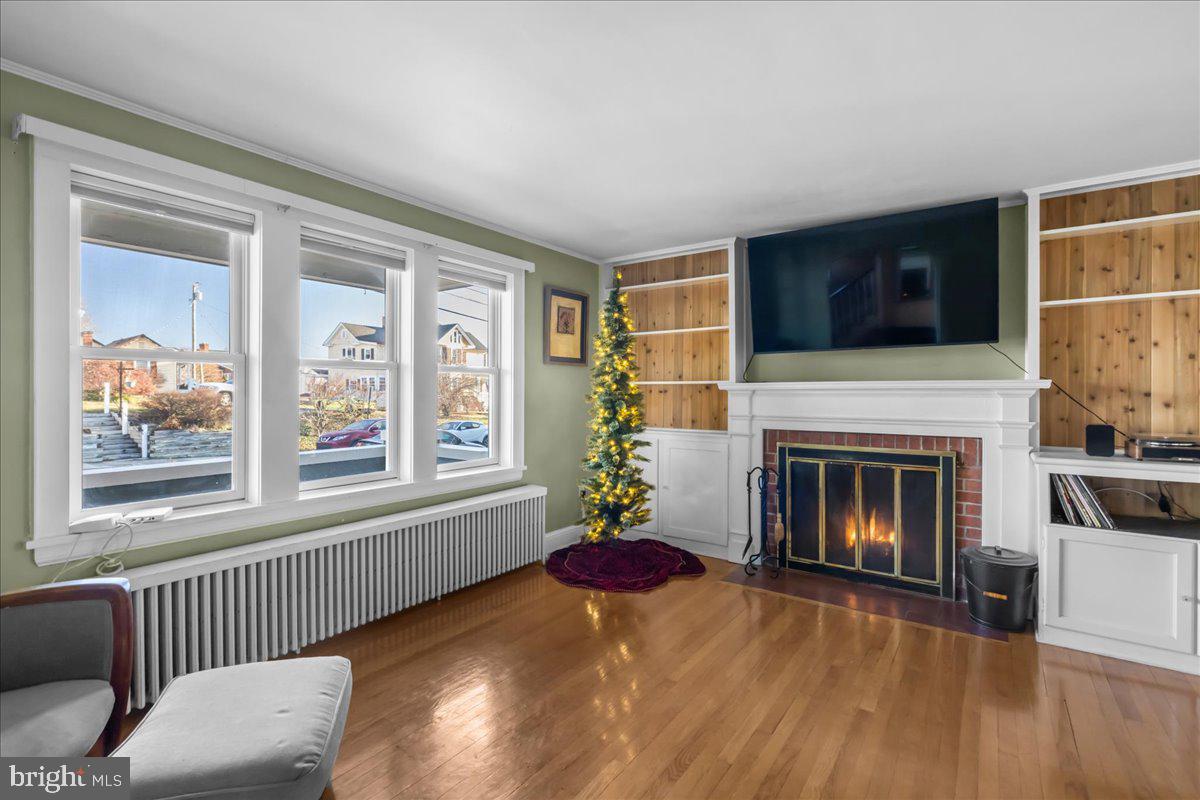 227 Miller Street Winchester, VA 22601 - Photo 4 of 51 a living room with furniture and a fireplace