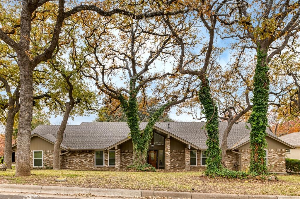 front view of a house with a trees