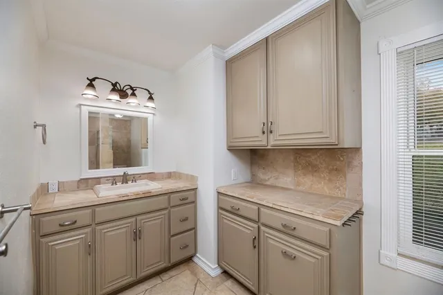a view with cabinets stainless steel appliances and a window