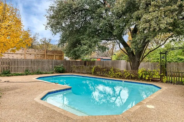a view of a house with swimming pool