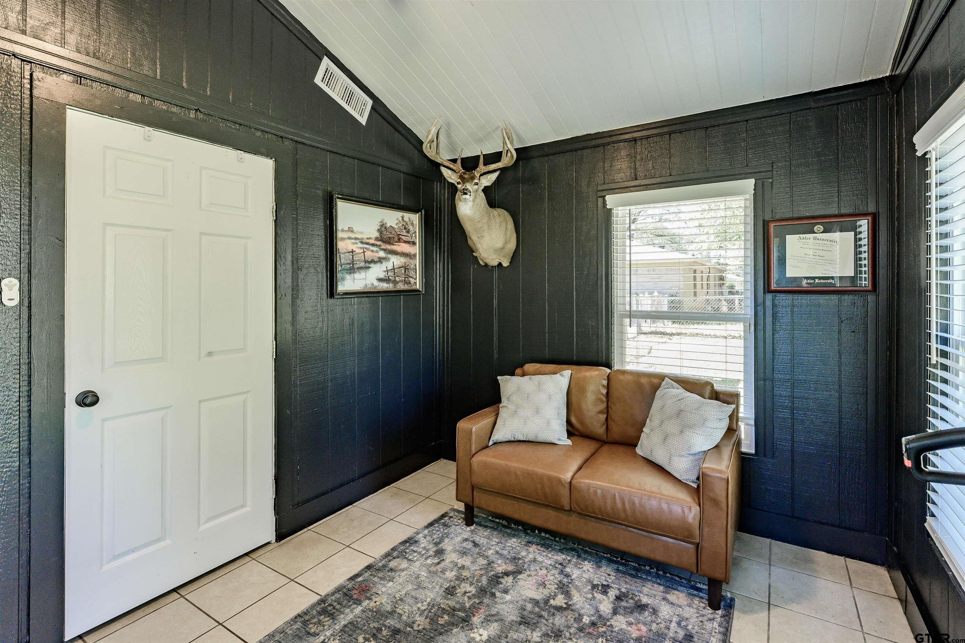 5921 Springbrook Drive Tyler, TX 75707 - Photo 14 of 39 a living room with furniture and a window