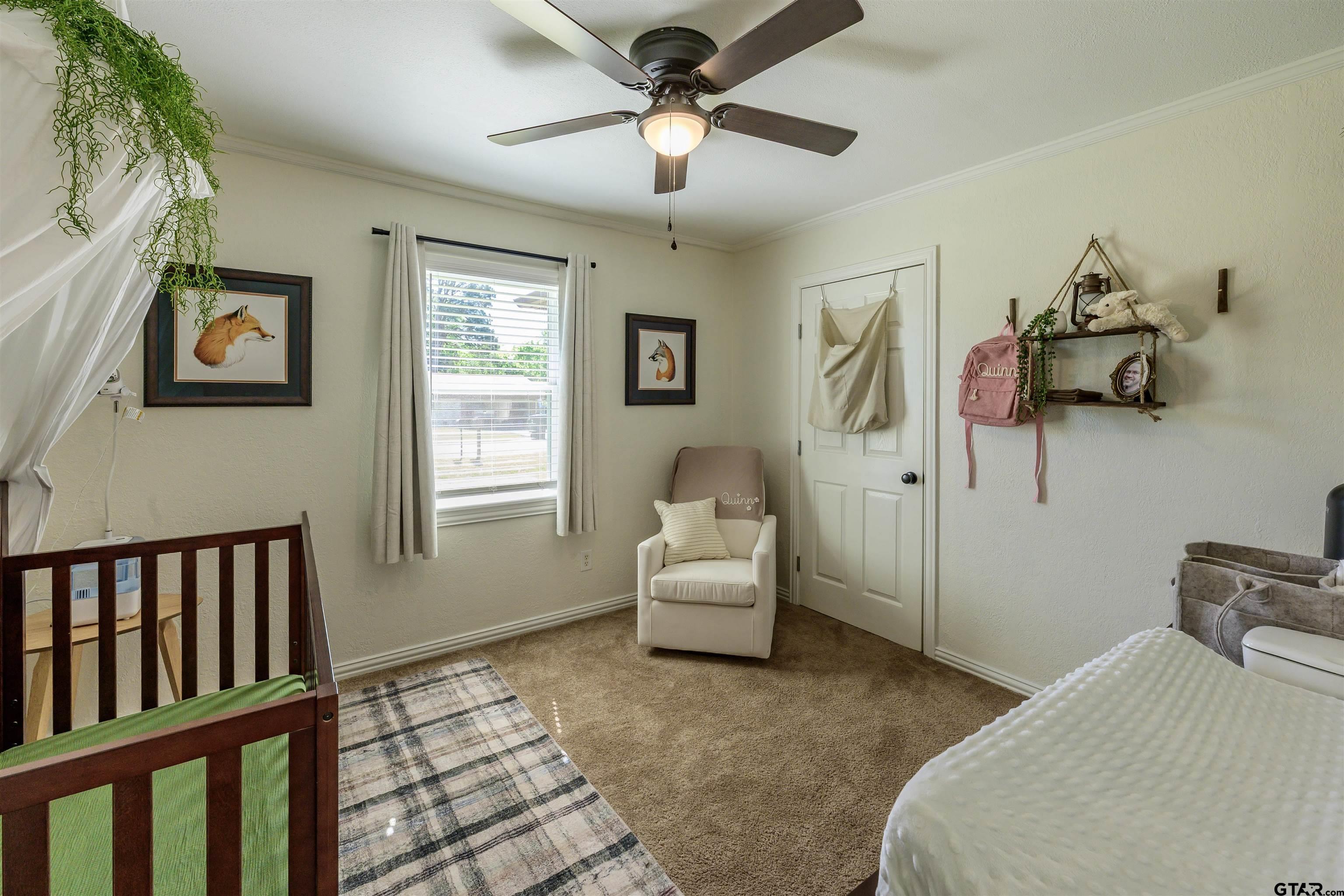 5921 Springbrook Drive Tyler, TX 75707 - Photo 19 of 39 a bedroom with furniture and a window