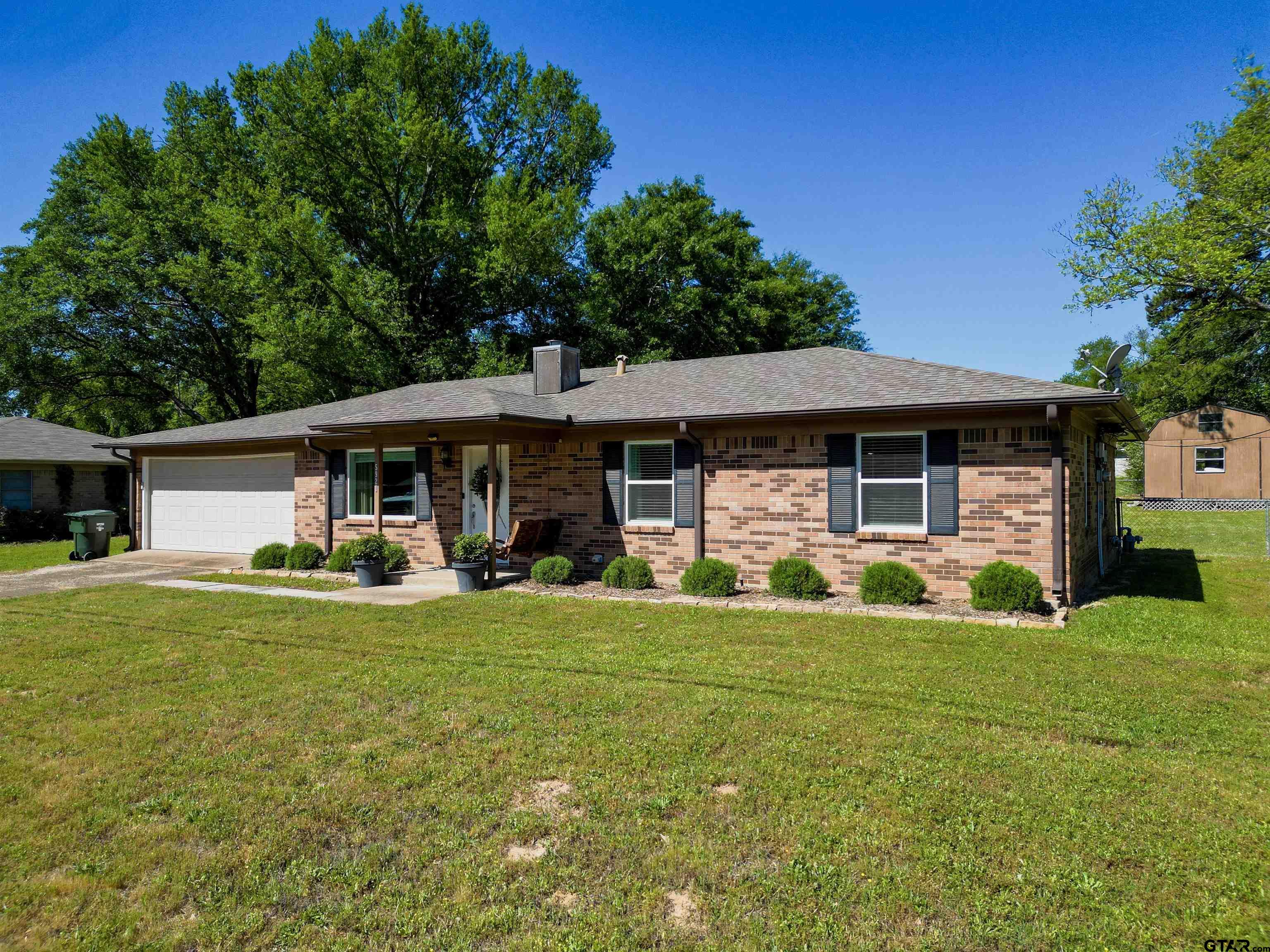 5921 Springbrook Drive Tyler, TX 75707 - Photo 2 of 39 a view of a house with a yard