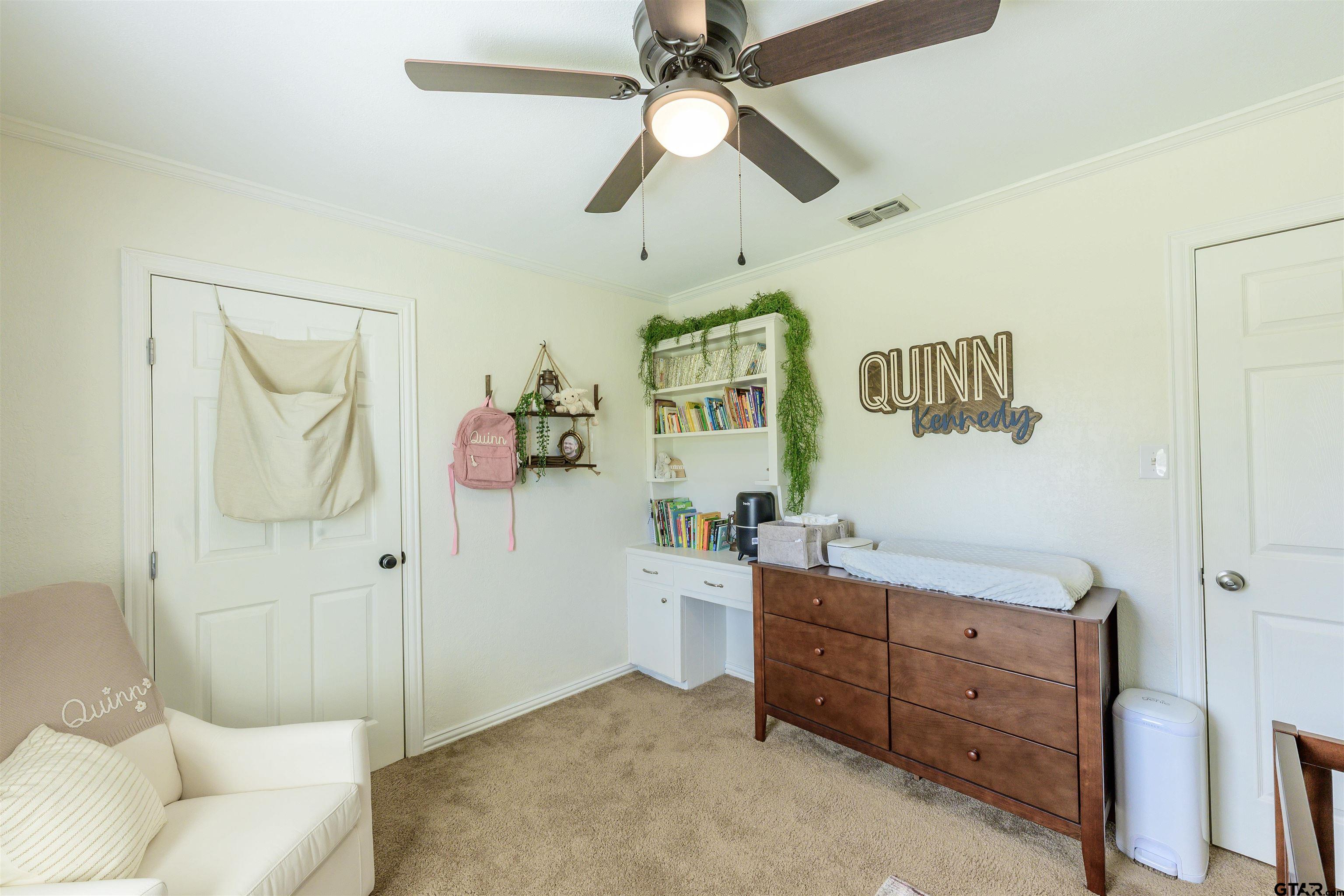 5921 Springbrook Drive Tyler, TX 75707 - Photo 21 of 39 a living room with furniture and a dresser