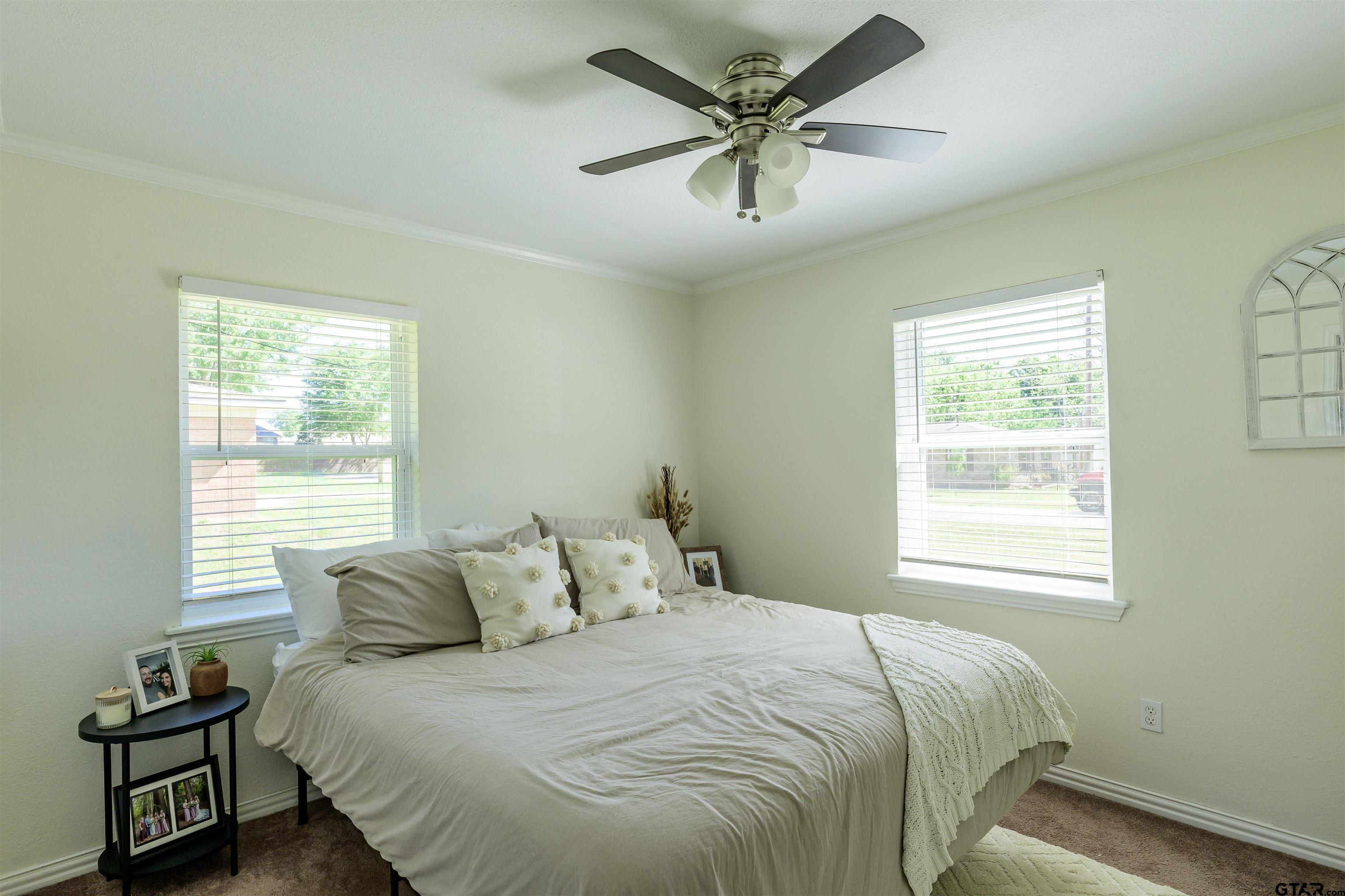 5921 Springbrook Drive Tyler, TX 75707 - Photo 23 of 39 a bedroom with a bed and a window