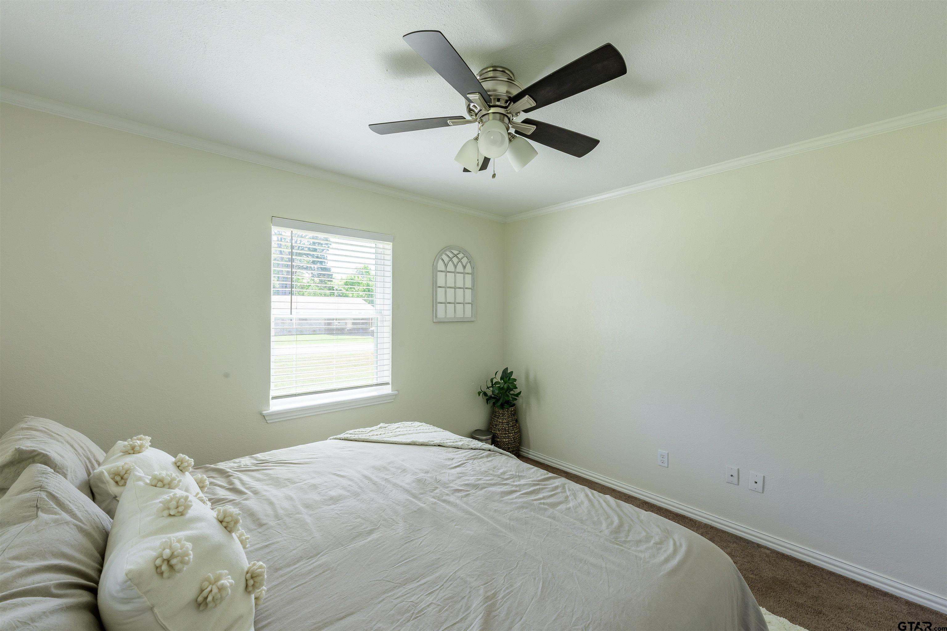 5921 Springbrook Drive Tyler, TX 75707 - Photo 25 of 39 a bedroom with a bed and a window