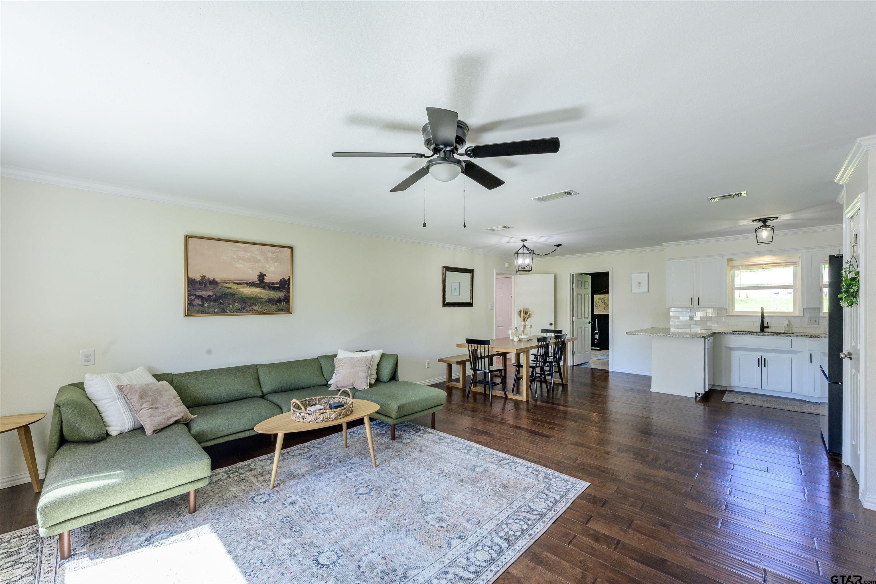 5921 Springbrook Drive Tyler, TX 75707 - Photo 3 of 39 a living room with furniture and a wooden floor