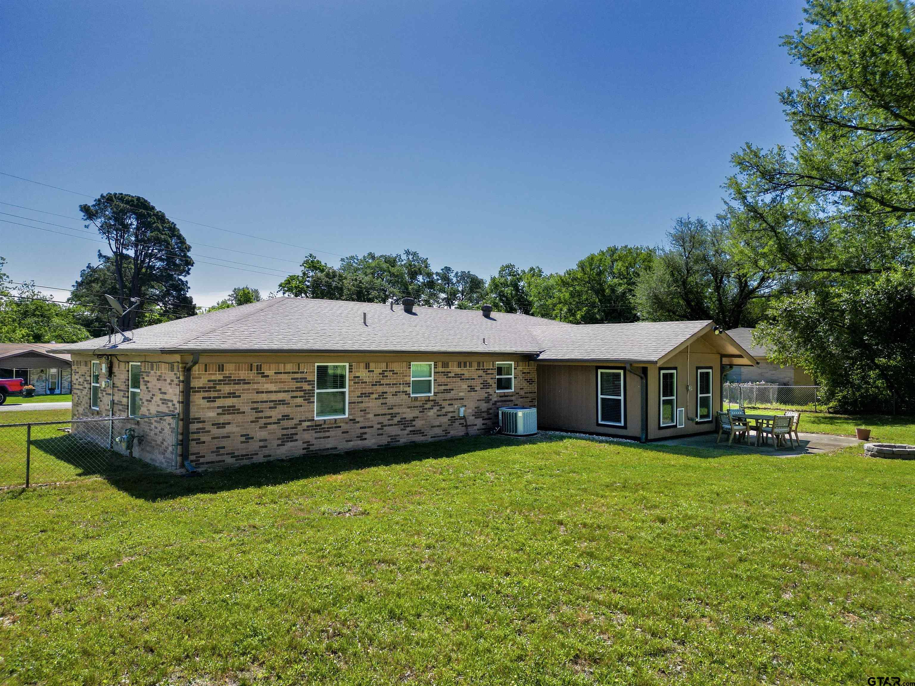5921 Springbrook Drive Tyler, TX 75707 - Photo 38 of 39 a view of a house with a yard and sitting area