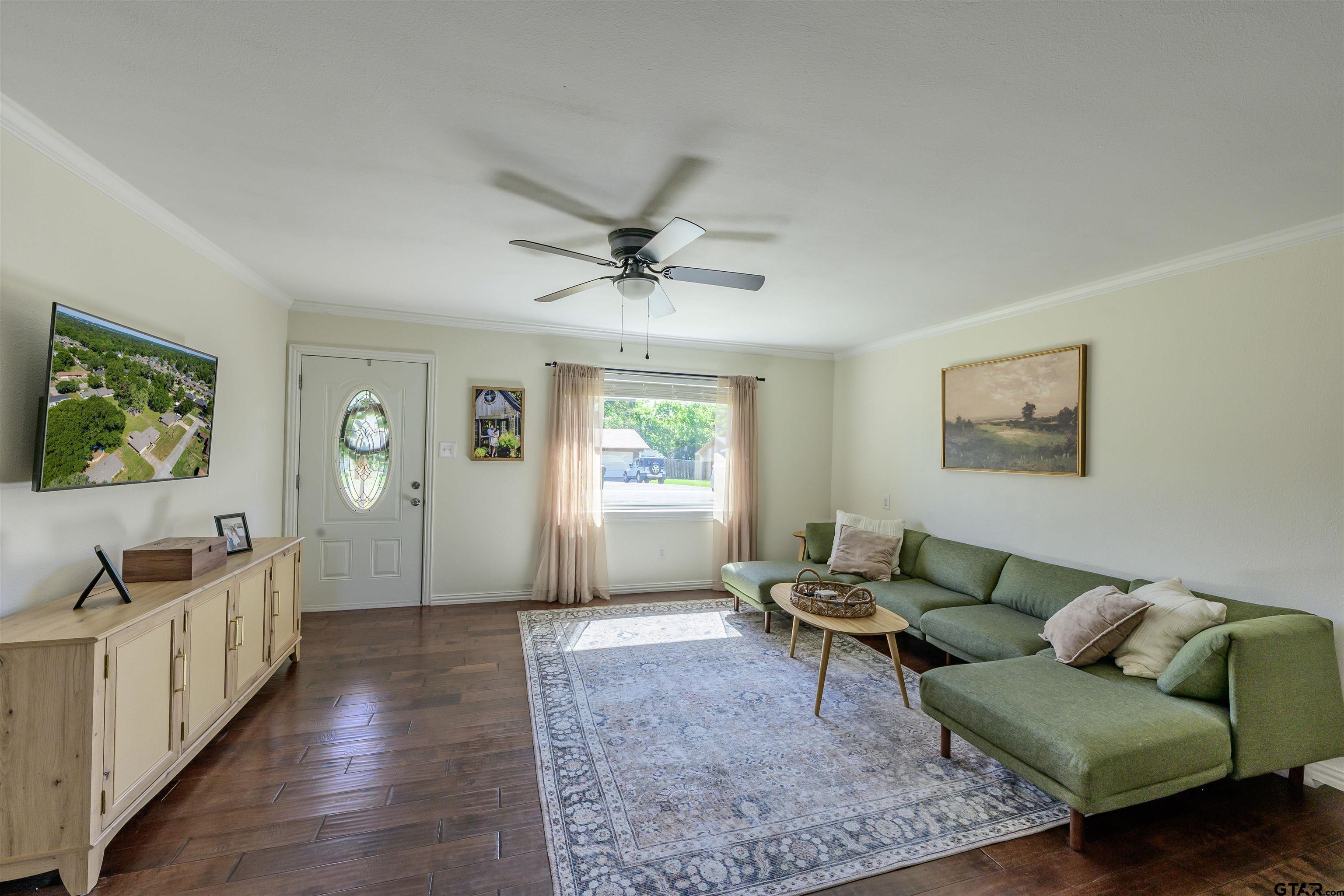 5921 Springbrook Drive Tyler, TX 75707 - Photo 5 of 39 a living room with furniture and a wooden floor