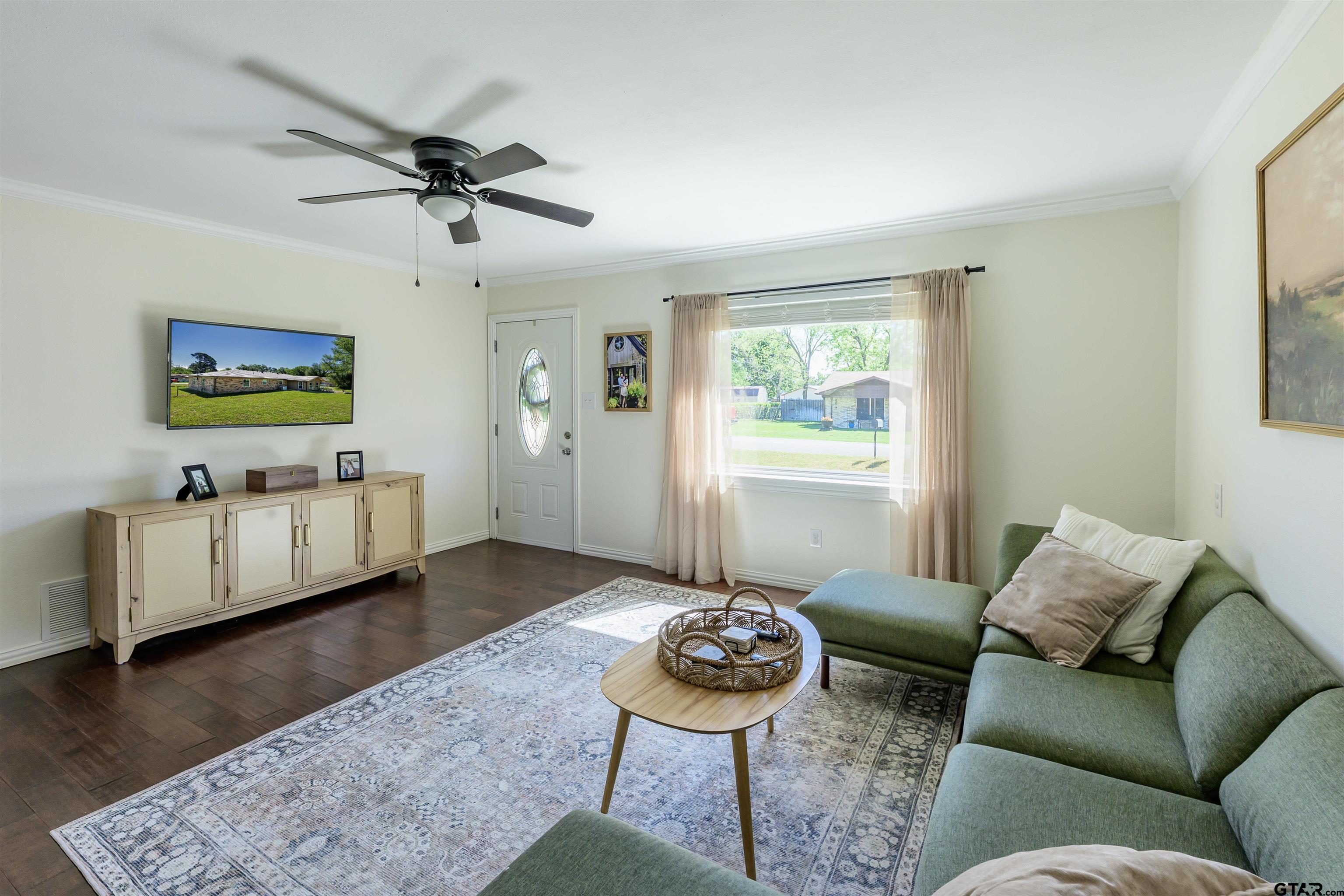 5921 Springbrook Drive Tyler, TX 75707 - Photo 6 of 39 a living room with furniture and a wooden floor