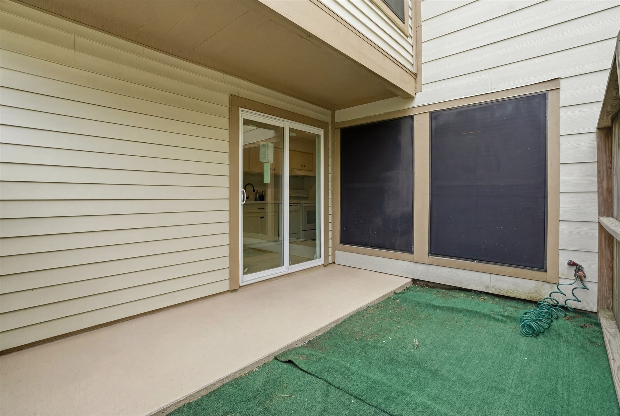2200 Cypress Landing Road, Unit A3 Houston, TX 77090 - Photo 10 of 17 Private, partially covered patio with low-maintenance turf and direct access to additional parking.