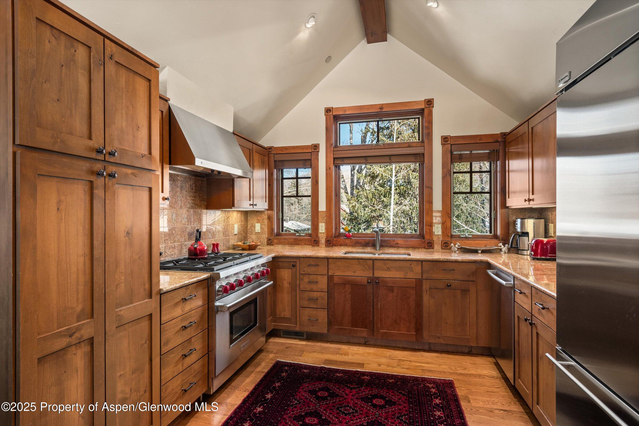 503 West Main Street, Unit B202 Aspen, CO 81611 - Photo 8 of 22 a kitchen that has a sink and a stove