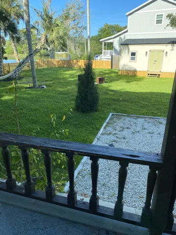 a view of a porch with a backyard
